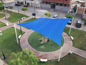 Rectangular tensile fabric shade structure in community park uae