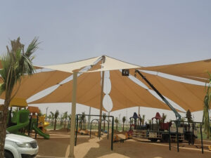 Large tensile fabric structure providing shade for playground abu dhabi