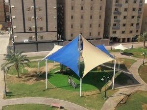 Blue and beige tensile canopy structure for public park sharjah