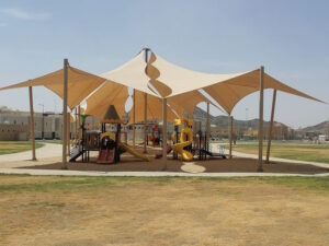 Cantilever tensile fabric structure over children’s playground